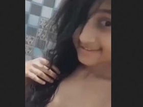 Cute Asian girl flaunts her body in a bathtub