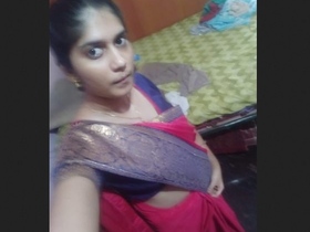 Indian woman displays her large breasts