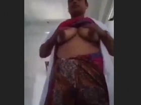 Indian nurse with big breasts on display