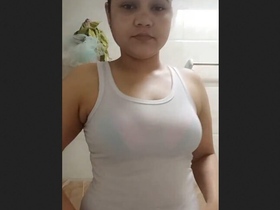 Gorgeous Indian woman seductively poses in the tub