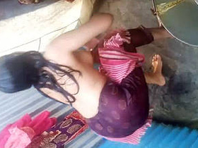 Desi girl gets filmed taking a shower in village