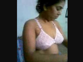 Indian beauty Poorna indulges in intimate activities in her room while wearing a pink lingerie
