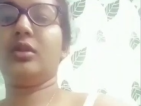 Watch a sexy Bengali girl strip and play with her breasts in the bathroom