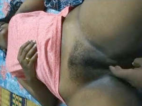 Tamil girl pleasures herself with her fingers