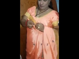 Mature Indian woman in lingerie performs sensual oral sex