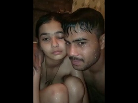 Cute couple enjoys bathing in India