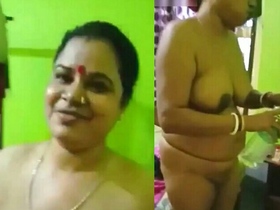 Fat Indian wife with large breasts gets naked in the countryside