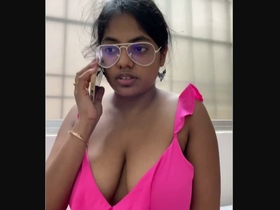 Watch a busty girl get naughty in the office
