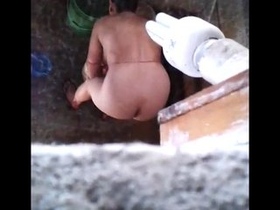 Indian aunty discovered undressed while bathing
