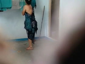 An Indian matron clad in a provocative saree becomes aroused and uninhibited in an open-air setting