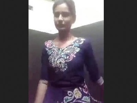 A young Desi girl undressing her dress in public