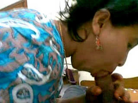 Indian girl gives a blowjob in village setting
