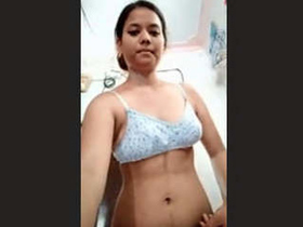 Watch an Indian girl flaunt her large breasts