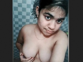 A cute desi girl gets naked in the bathtub