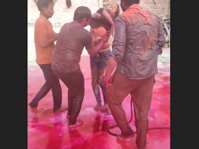 Three guys have fun by pressing on an Indian girl's desi boobs during holi