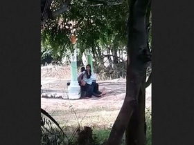 Spy on a college lover's outdoor fucking session in a sexy dress