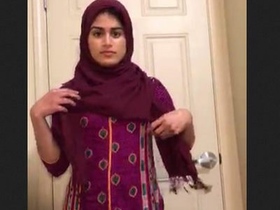 Muslim hijab-clad woman with a big butt