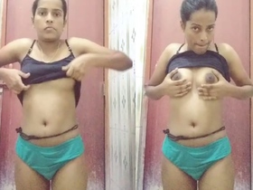 Lovely bhabi strips naked in the bathroom for MMS