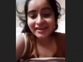 Watch as a stunning babe flaunts her ample bosom in a video call